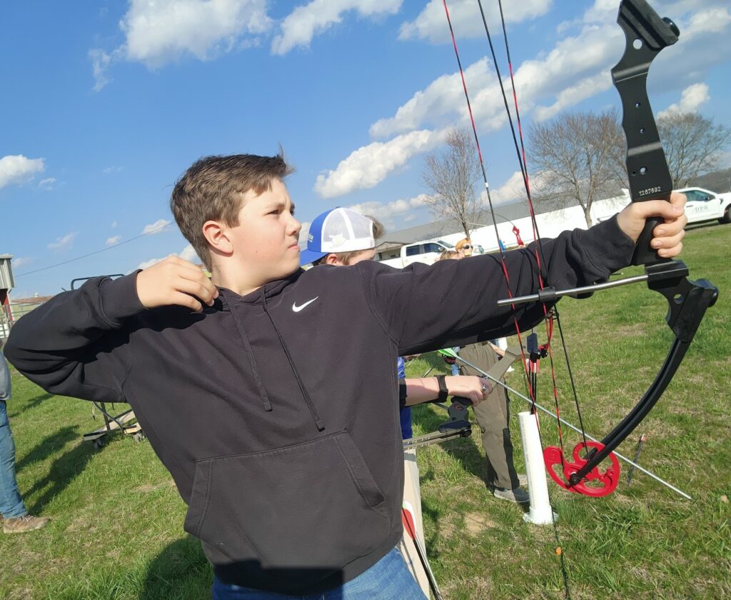 Action shot of archery team member.