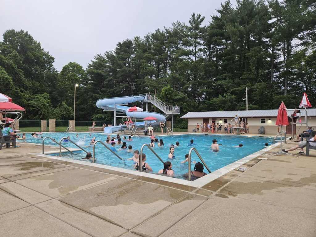 Kids in a swimming pool.